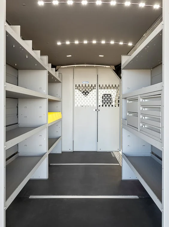 Customized shelving and storage inside of an upfitted white van